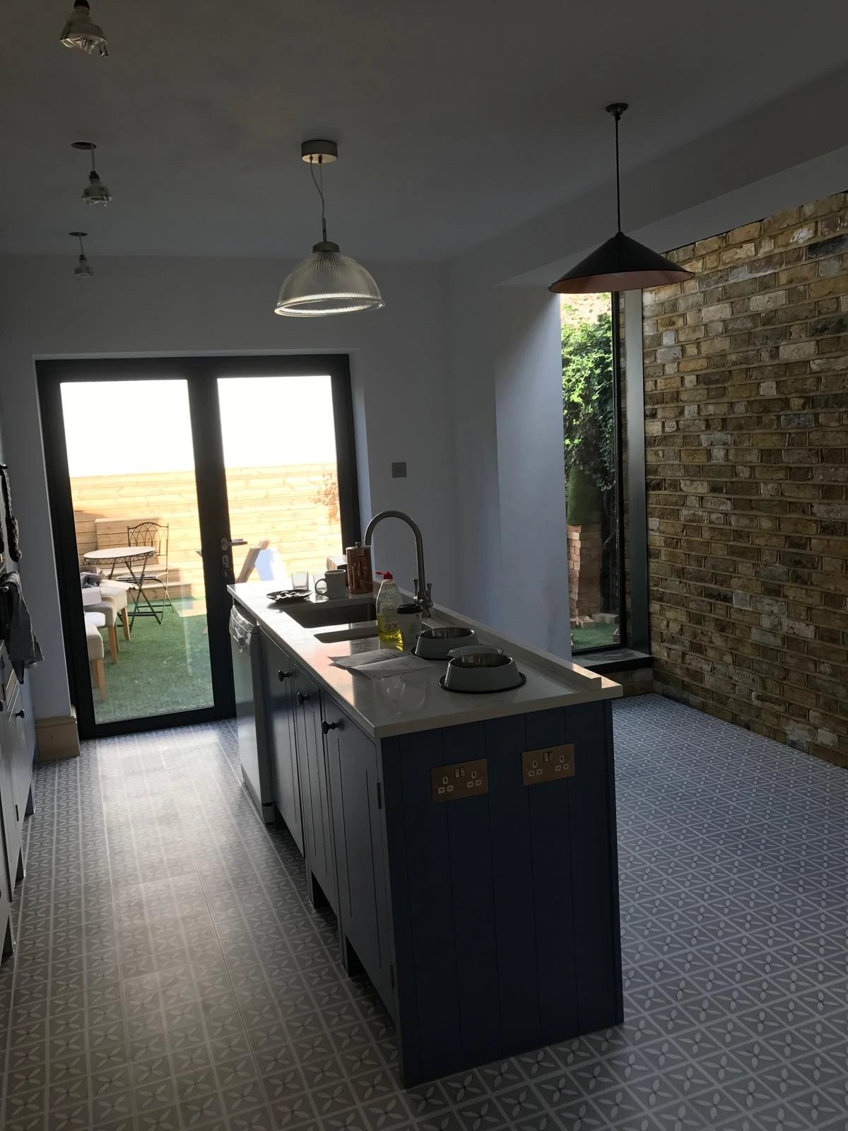Side return kitchen extension with exposed London stock brick and a glazed slot window