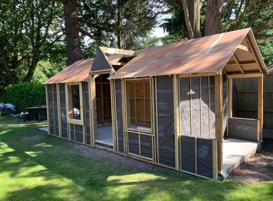 Timber garden building framed and roofed before cladding