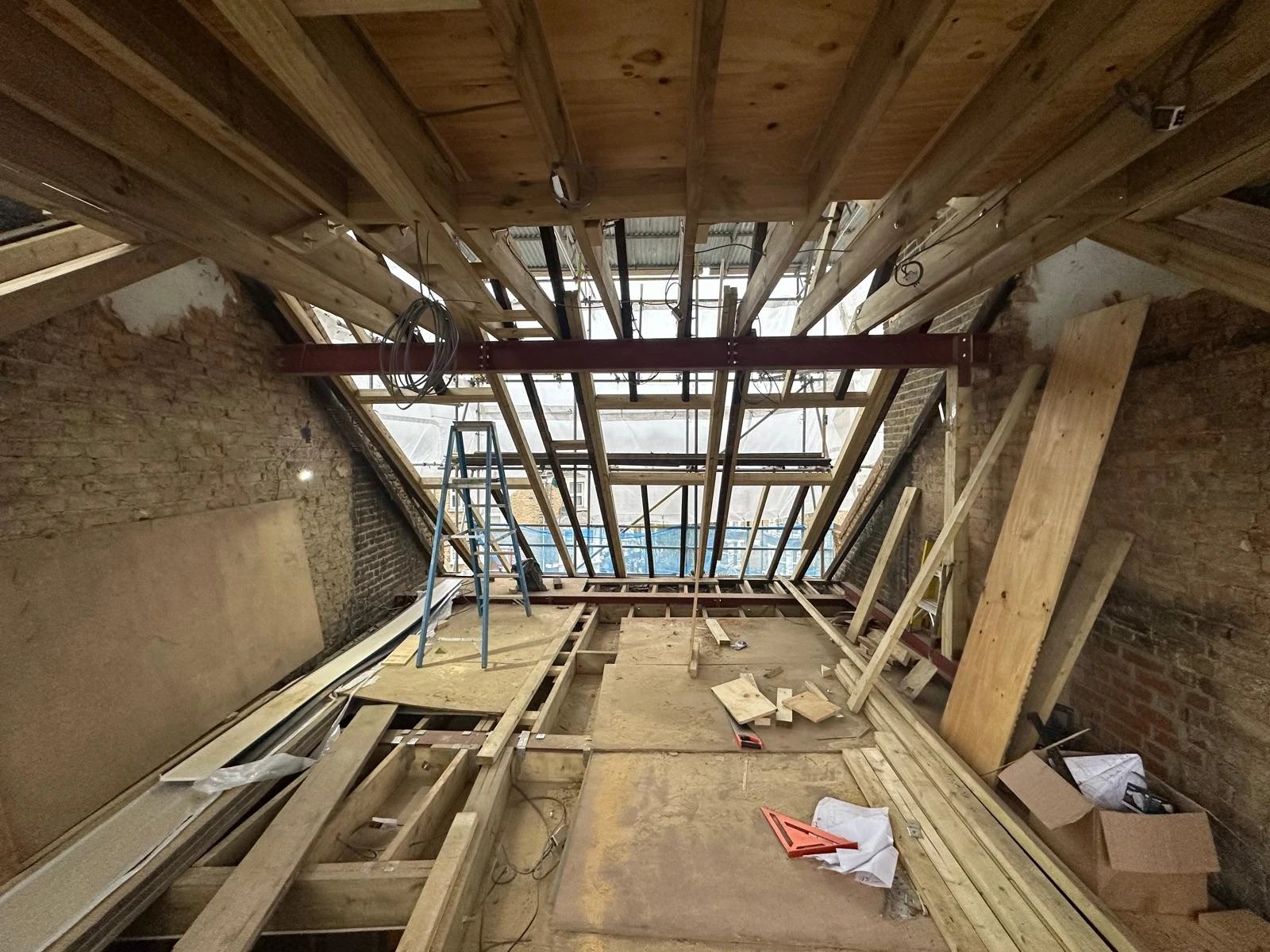 Loft conversion shell with a new steel, rafters and floor joists in