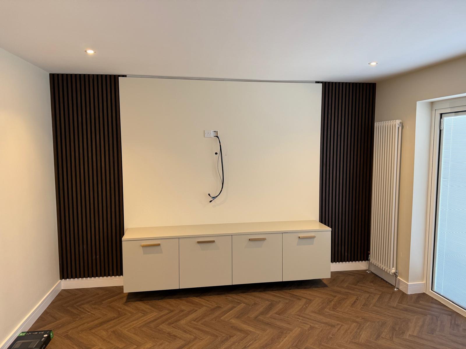 Media wall with timber slat panels and a floating cabinet